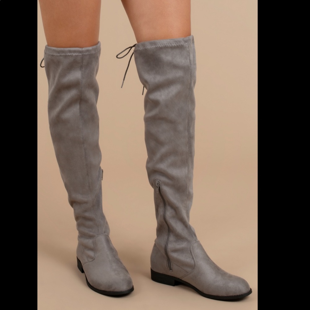 Gray knee high boots with tie in the back
